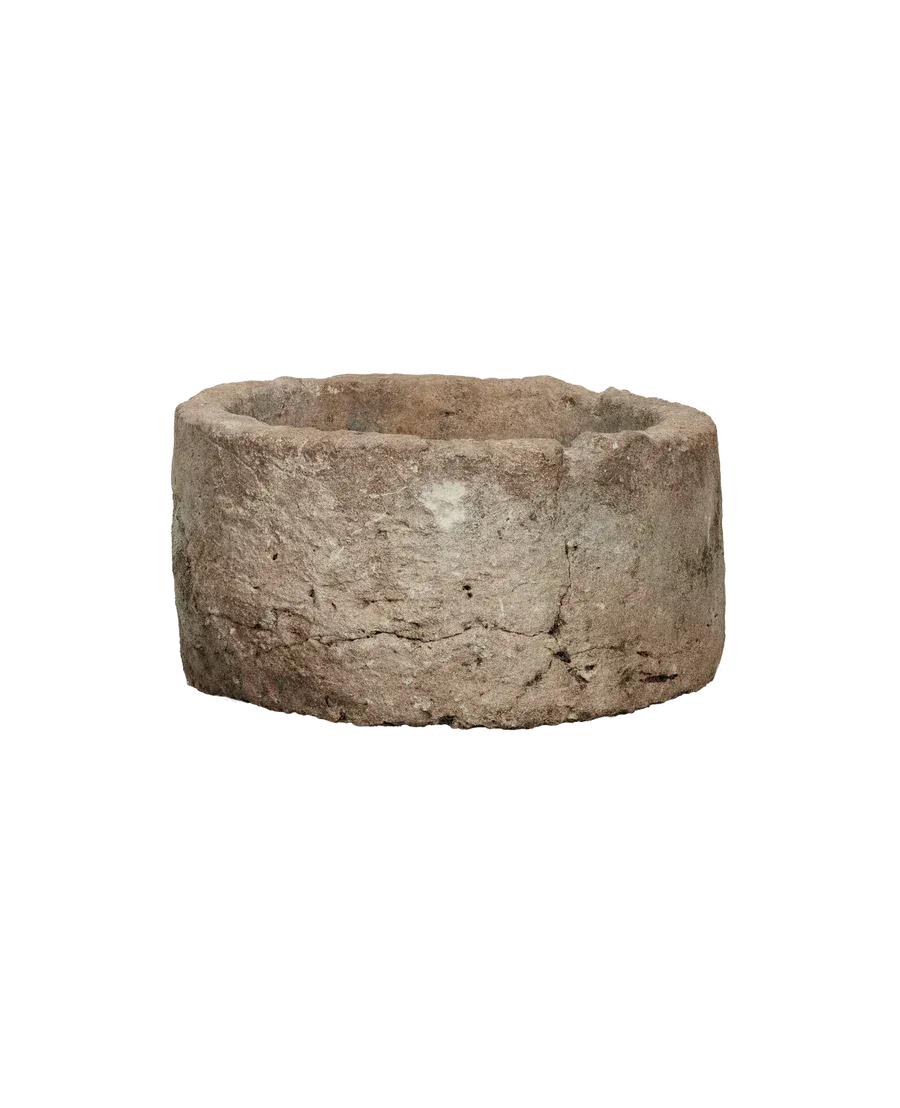 Round limestone trough planter with rustic texture for interior plantscapes by Trendy Gardener