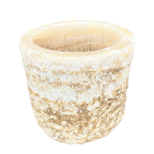 Onyx stone planter shown from an angled view with textured exterior detail