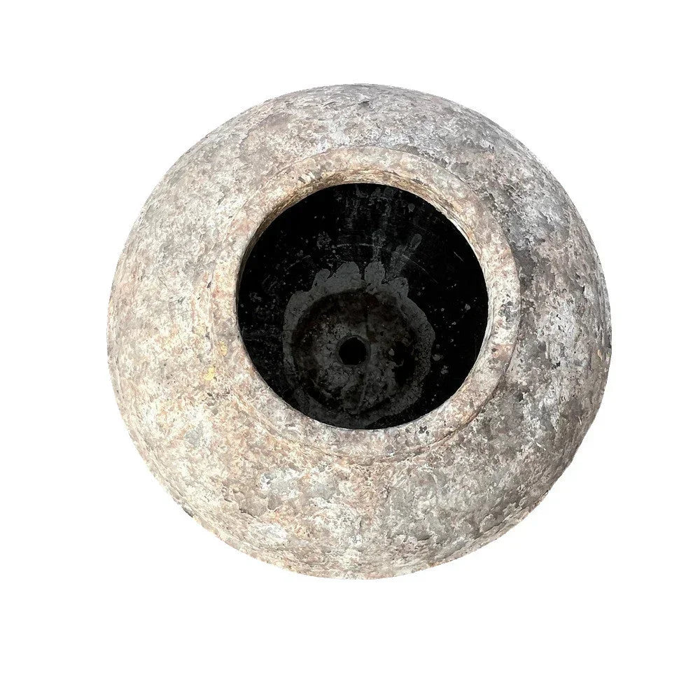 Indonesian terracotta round planter styled in a refined interior, 22.5"W × 22.5"D × 24.5"H, with sculptural plant accent.