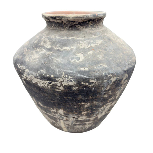 Decorative Vietnamese terracotta vessel shown from an angled view