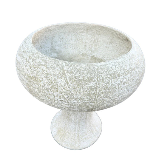 White concrete compote planter featuring a shallow oval bowl, sculptural pedestal base, and distressed textured surface.