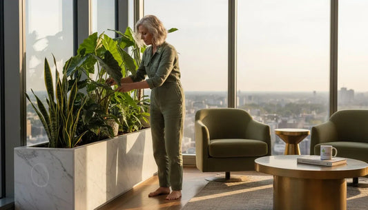 Woman arranging tropical plants in penthouse