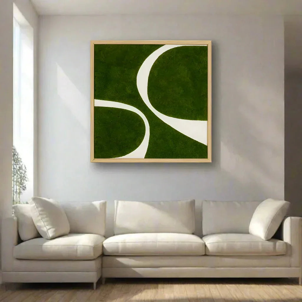 Abstract moss wall art with green moss and white curves in a modern living room above a sofa
