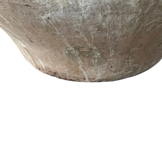 Textured terra cotta surface detail with timeworn patina