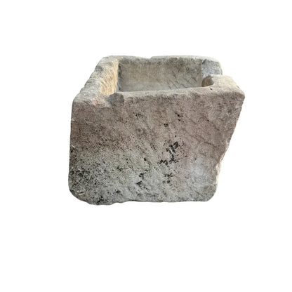Antique limestone planter in a timeworn stone finish, styled as a statement vessel