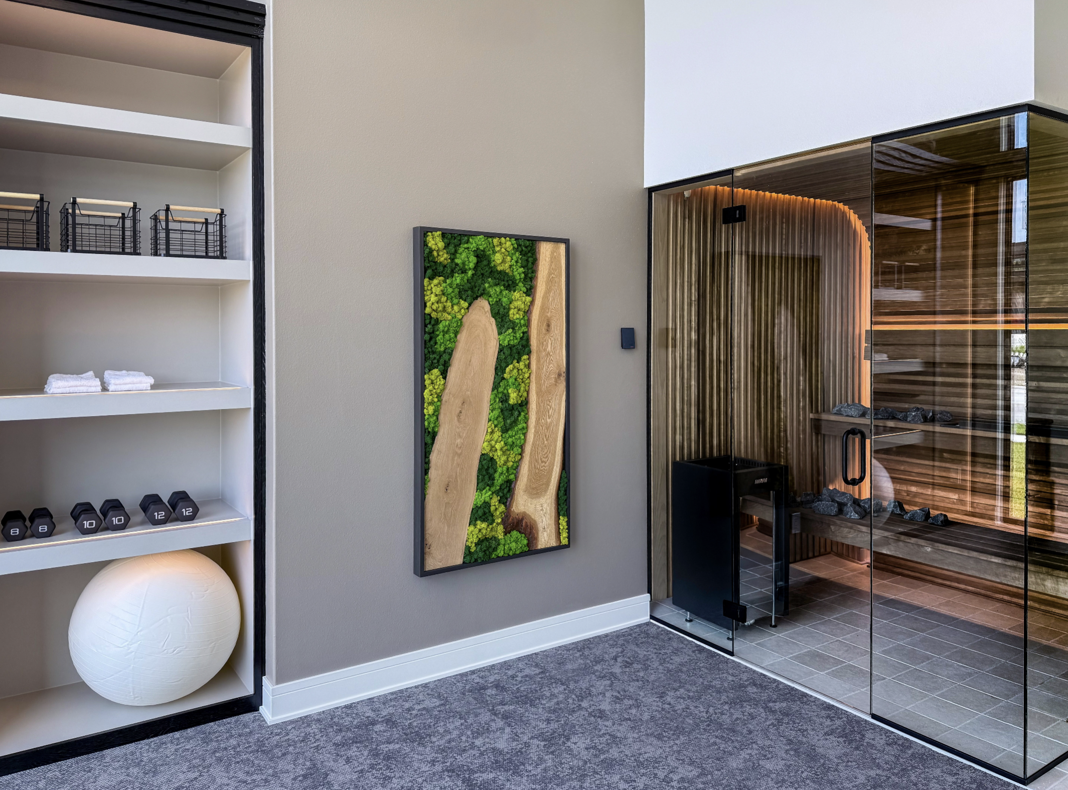 Custom preserved moss wall and complementary biophilic décor in a Waukee, Iowa spa and gym, adding texture, acoustic softening, and a distinct sense of place without ongoing watering or light requirements.