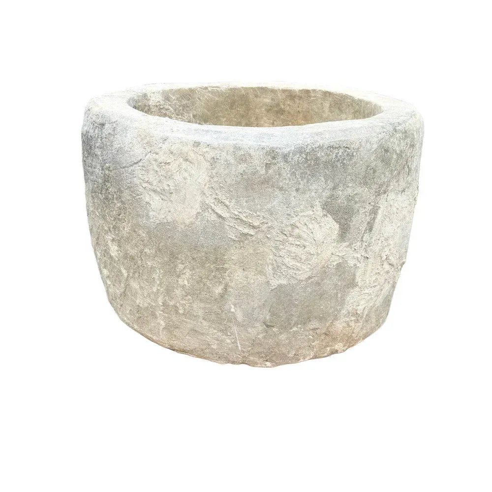 Front view of antique Indonesian round limestone trough planter, 29.5"W × 29.5"D × 24.5"H with 21" interior opening.
