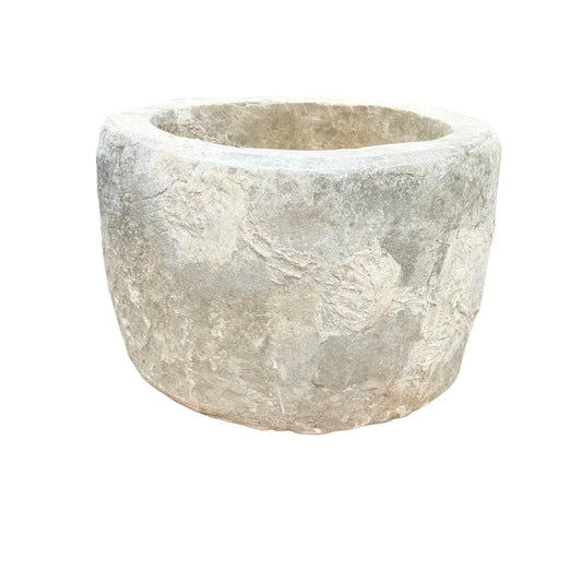 Front view of antique Indonesian round limestone trough planter, 29.5"W × 29.5"D × 24.5"H with 21" interior opening.