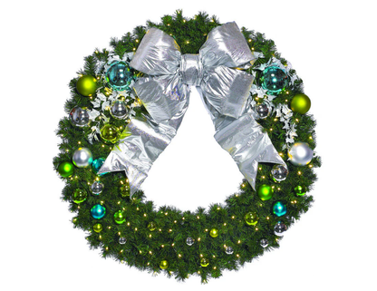 Coastal-inspired commercial Christmas tree and wreath decor with soft blues, silvers, and natural textures for modern interiors