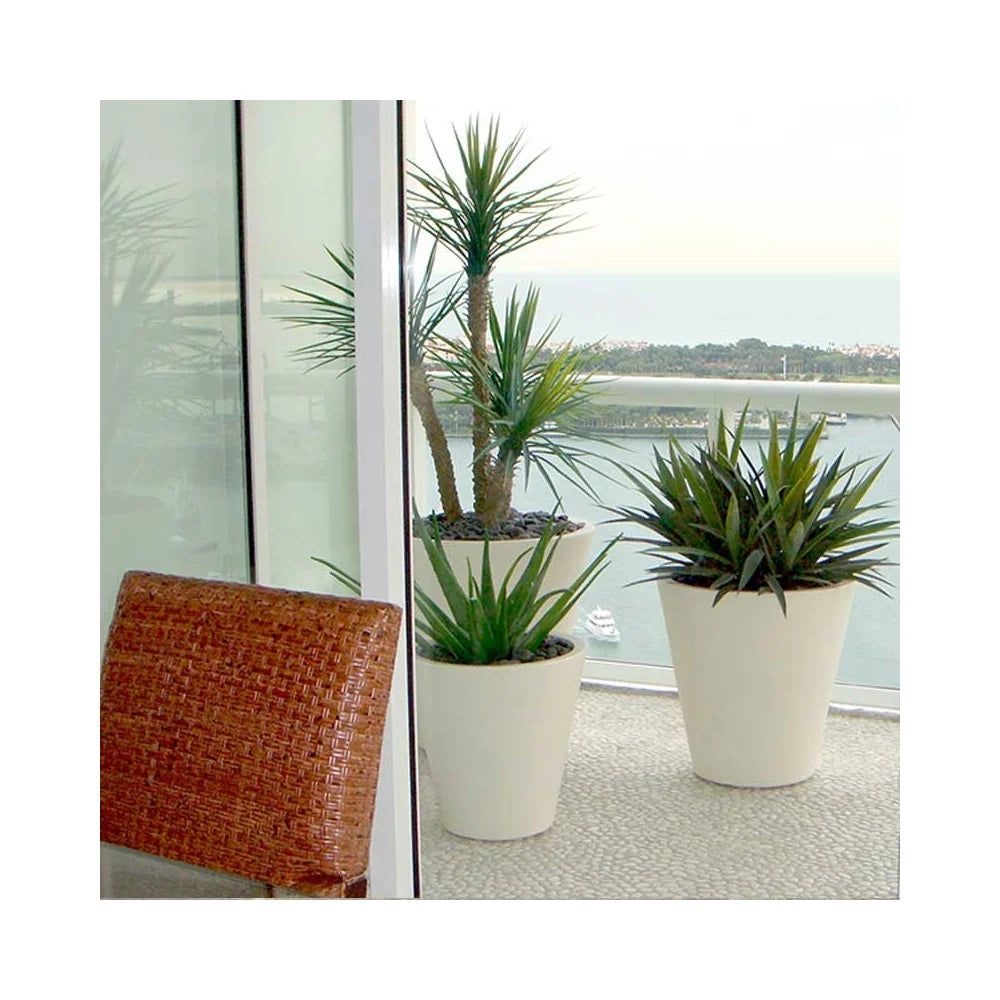 The Pego oval planter with a smooth, modern design and durable construction, perfect for adding a touch of elegance to indoor and outdoor plantscaping in residential or commercial spaces