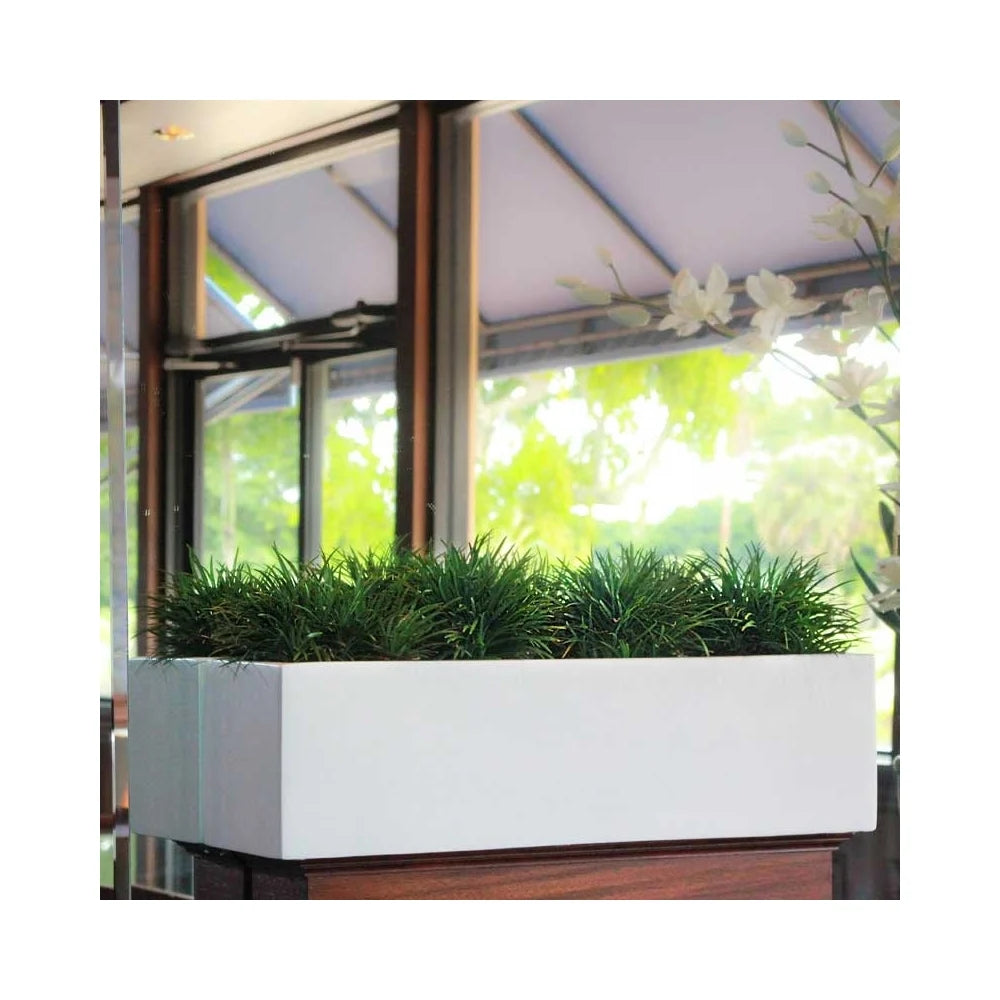 The Kiel rectangle planter, featuring a sleek and contemporary design in a durable finish, perfect for modern interior and exterior plantscaping in residential and commercial settings.