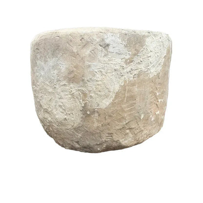 Side profile of Indonesian limestone trough planter, showing natural stone texture and weathered patina, 29.5"W × 24.5"H.