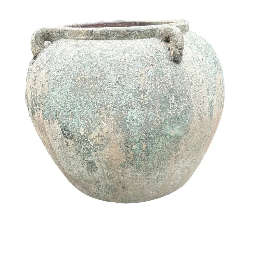Large round terracotta planter with four handles shown from an angled view