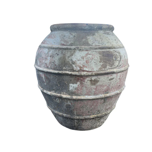 Vietnamese terracotta planter with a rounded silhouette and handcrafted finish