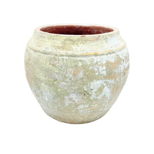 Small Vietnamese terracotta pot shown from an angled side view