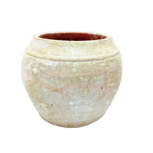 Vietnamese terracotta pot with a rounded handcrafted form and warm natural finish